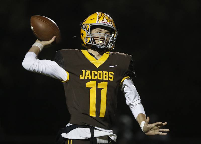 Jacobs' Max Benner throws a pass during a IHSA Class 7A first round playoff football game Friday, Oct. 28, 2022, between Jacobs and Brother Rice at Jacobs High School in Algonquin.