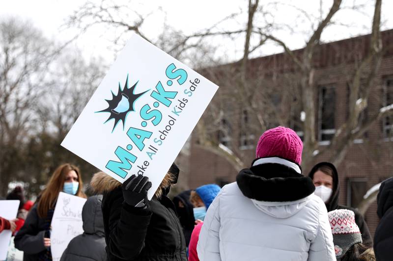 Parents who are in favor of continuing to require masks in schools rallied outside Community Unit School District 200 headquarters in Wheaton on Monday, Feb. 7, 2022. The rally was organized by the group M.A.S.K.S., which stands for Make All School Kids Safe.
