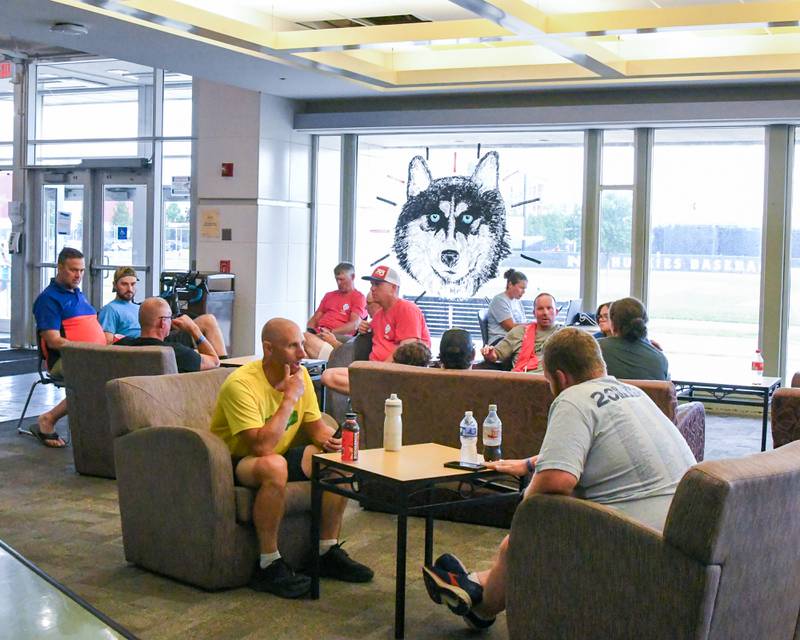 Participants from the Cycle Across Illinois relax in the lobby of the Stevenson Towers on the campus of Northern Illinois university’s campus in DeKalb on Saturday July 12, 2025, before finishing the ride Sunday Morning.