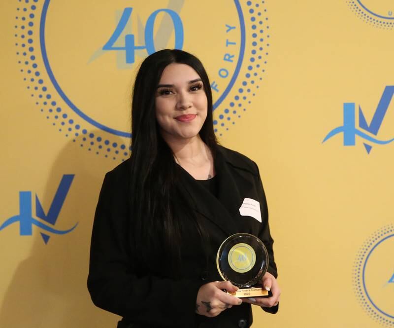 Angelica Rivera poses for a photo with her award during the 40 Under Forty awards banquet on Thursday, March 21, 2024 at Westclox in Peru.