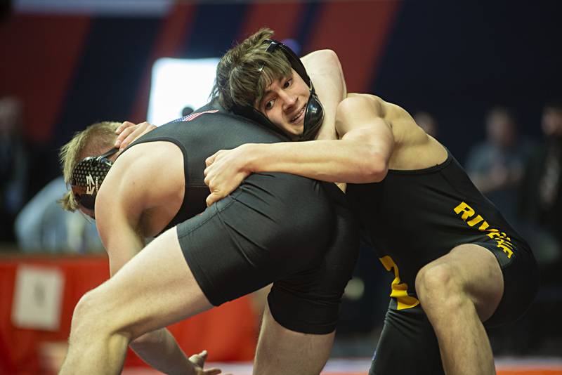 Riverdale's Collin Altensey works against  Jack Seacrist of Stillman Valley during the 1A 152lb finals match at the IHSA state wrestling meet on Saturday, Feb. 19, 2022.