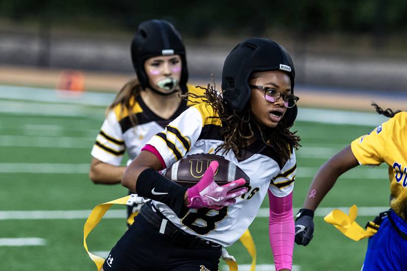 Joliet West's Londyn Clemons dodges the Joliet Central defense during a varsity flag football game at Joliet Central on Oct. 2, 2025.