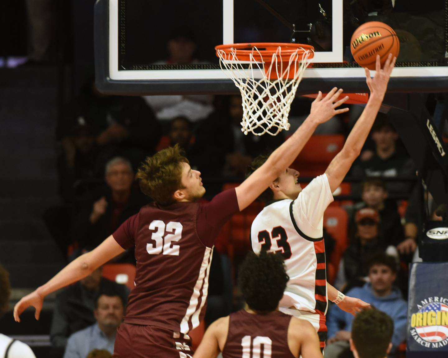 Joe Lewnard/jlewnard@dailyherald.com
Benet Academy's Brayden Fagbemi, right, celebrates with teammate Sam Driscoll after drawing a foul on a basket during the Class 4A boys basketball state championship at State Farm Center in Champaign Saturday.