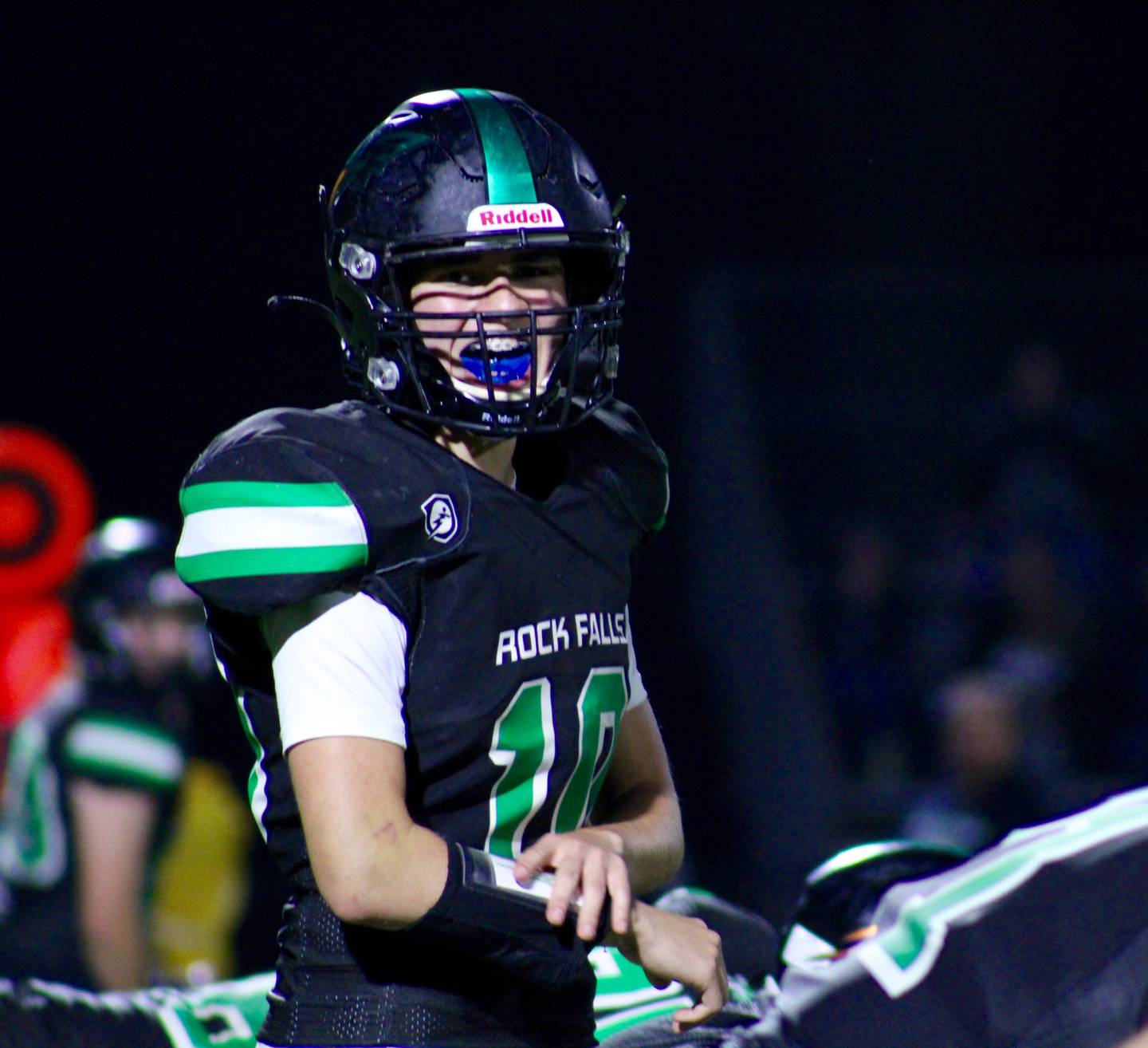 Rock Falls quarterback Easton Canales (10) calls a play during the first half on Friday, Oct. 8, 2021 during its homecoming game against North Boone.