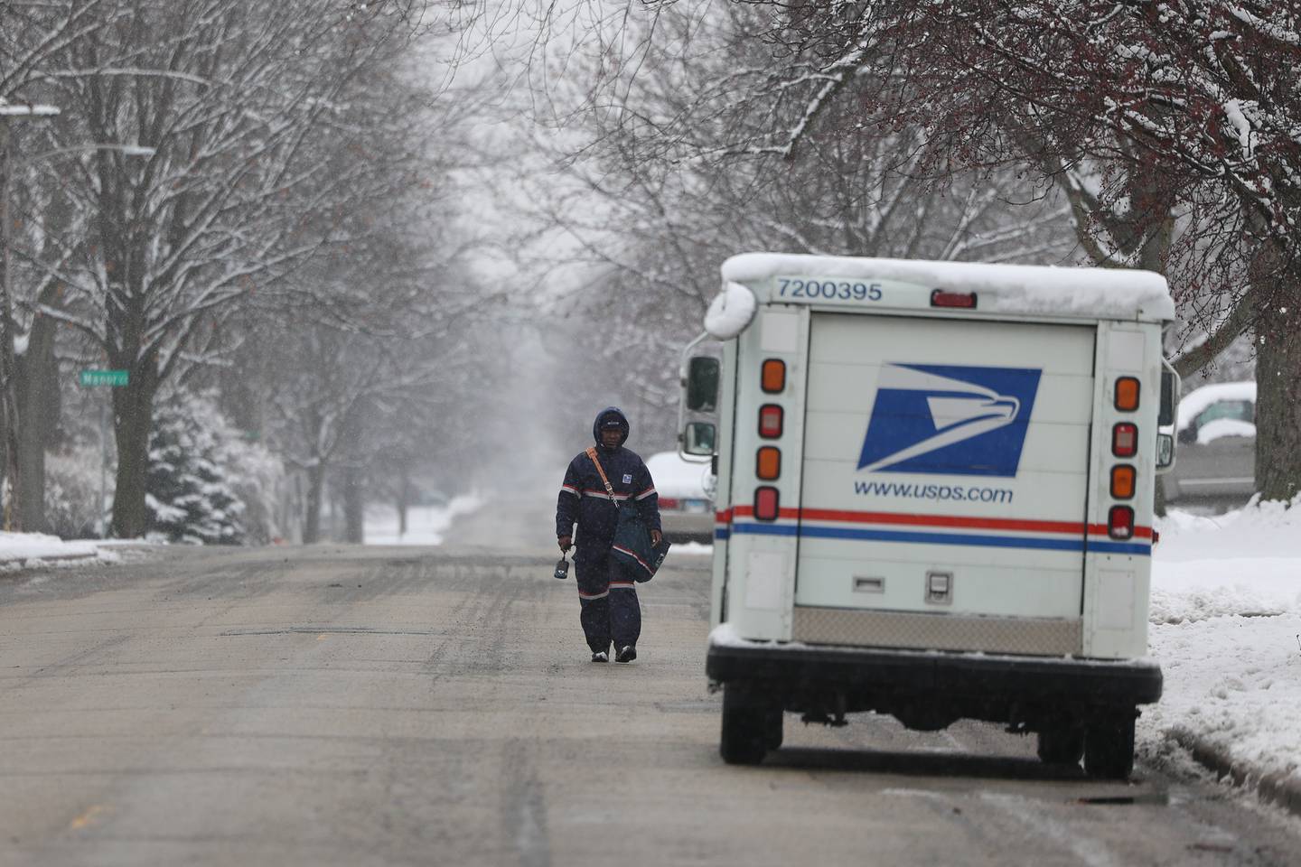 A mail carrier returns to their truck along Wheeler Avenue in Joliet on Wednesday January 25th, 2023.