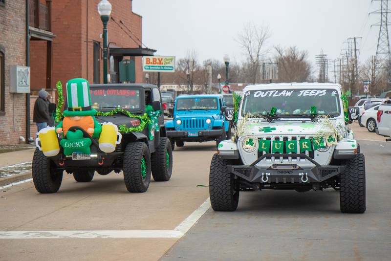 Members of the Jeep Monkeys Illinois Club flaunt their St.Patrick's Day decor during Dixon's parade on Saturday, March 18, 2023.