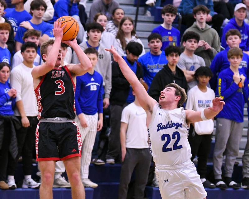 Glenbard East's Danny Snyder (3) makes a basket while being defended by Riverside-Brookfield's Benjamin Biskupic (22) during the game on Tuesday Feb. 3, 2026, held at Riverside-Brookfield High School.