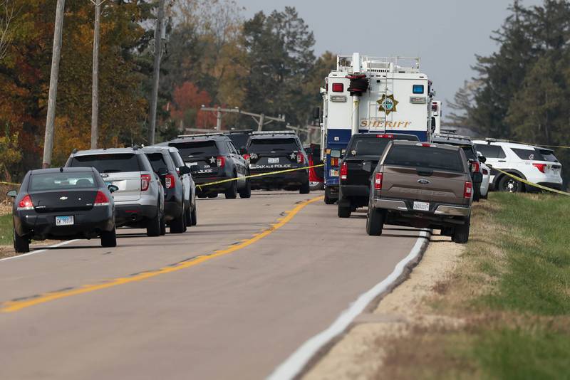 DeKalb County sheriff's deputies and law enforcement authorities investigate the scene of a fatal police shooting on Wednesday, Oct. 23, 2024 on Rich Road just west of Nelson Road in DeKalb Township. A man was shot and killed by police after an hours-long standoff involving a hostage. The man allegedly fired multiple rounds at officers, who returned fire, authorities said.