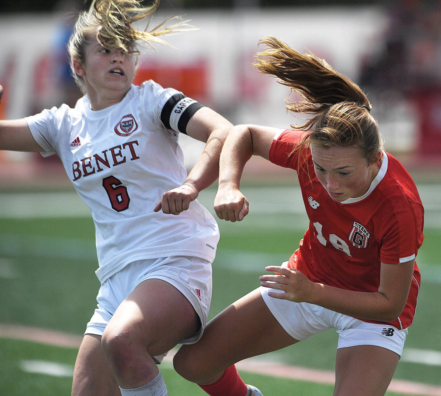 Benet Academy’s Sadie Sterbenz slams into Glenwood’s Rowann Law in the IHSA girls Class 2A state soccer championship game at North Central College in Naperville on Saturday, June 3, 2023.