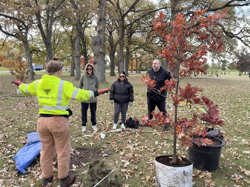 An Openlands apprentice explains the tree-planting strategy to volunteers. As part of its Season of Purpose during which its teammates are engaging in community service activities, Advocate Health planted 75 trees at Advocate Good Shepherd Hospital in Barrington.