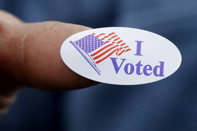 A voter shows off his “I Voted” sticker on Monday, Nov. 4, 2024, after voting at the Algonquin Township Office at 3702 US Hwy 14, in Crystal Lake.