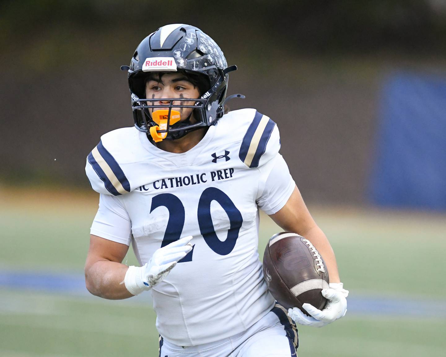 IC Catholic Prep's KC Kekstadt (20) runs the ball during the 3A Playoff game against Chicago Hope Academy on Saturday Nov. 1, 2025, held at Altgeld Park in Chicago.