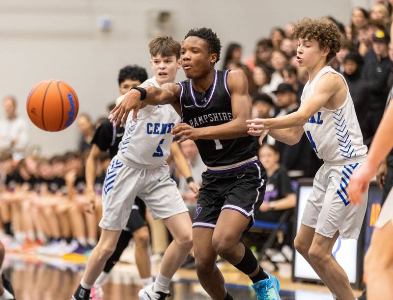 Hampshire guard Chayse Gray, middle, passes the ball during a game at Burlington Central High School on Friday, Dec. 22, 2023.