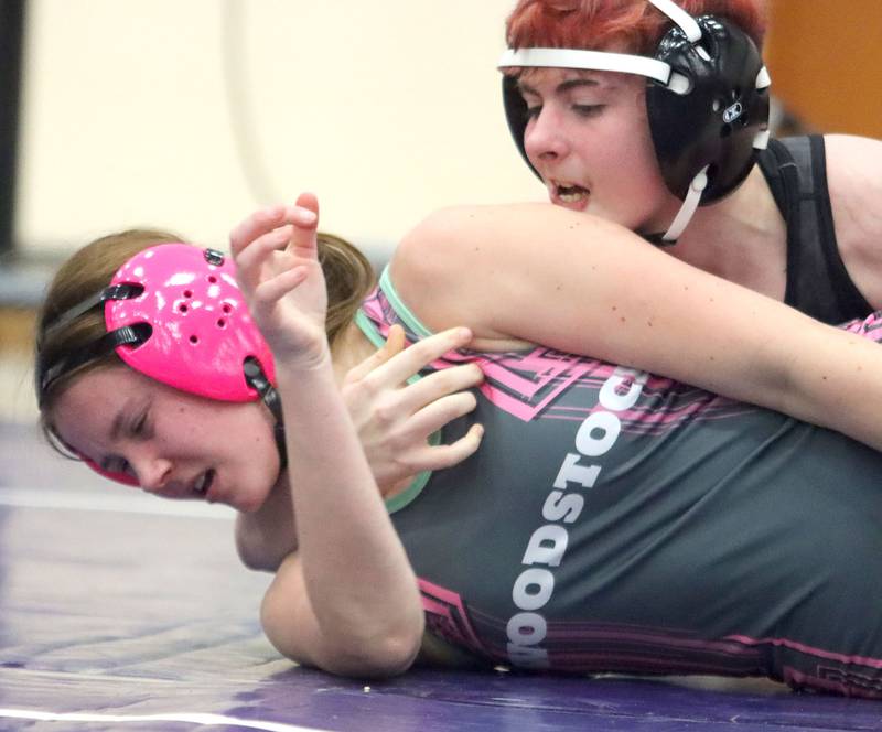 Woodstock’s Tayler Menzel, bottom, battles Sycamore’s Winter Beard at 135 pounds in Whip-Pur Women’s Classic varsity girls wrestling on Saturday, Dec. 20, 2025, at Hampshire High School in Hampshire.