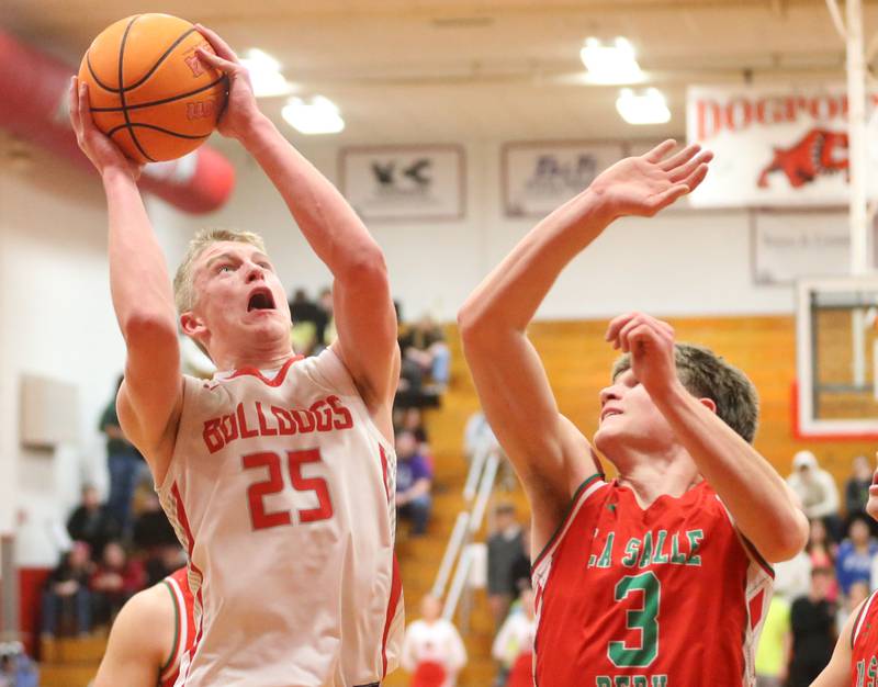 Streator's Joseph Hoekstra lets go of a shot over L-P's Braylin Bond on Tuesday, Jan. 13, 2026 in Pops Dale Gymnasium at Streator High School.