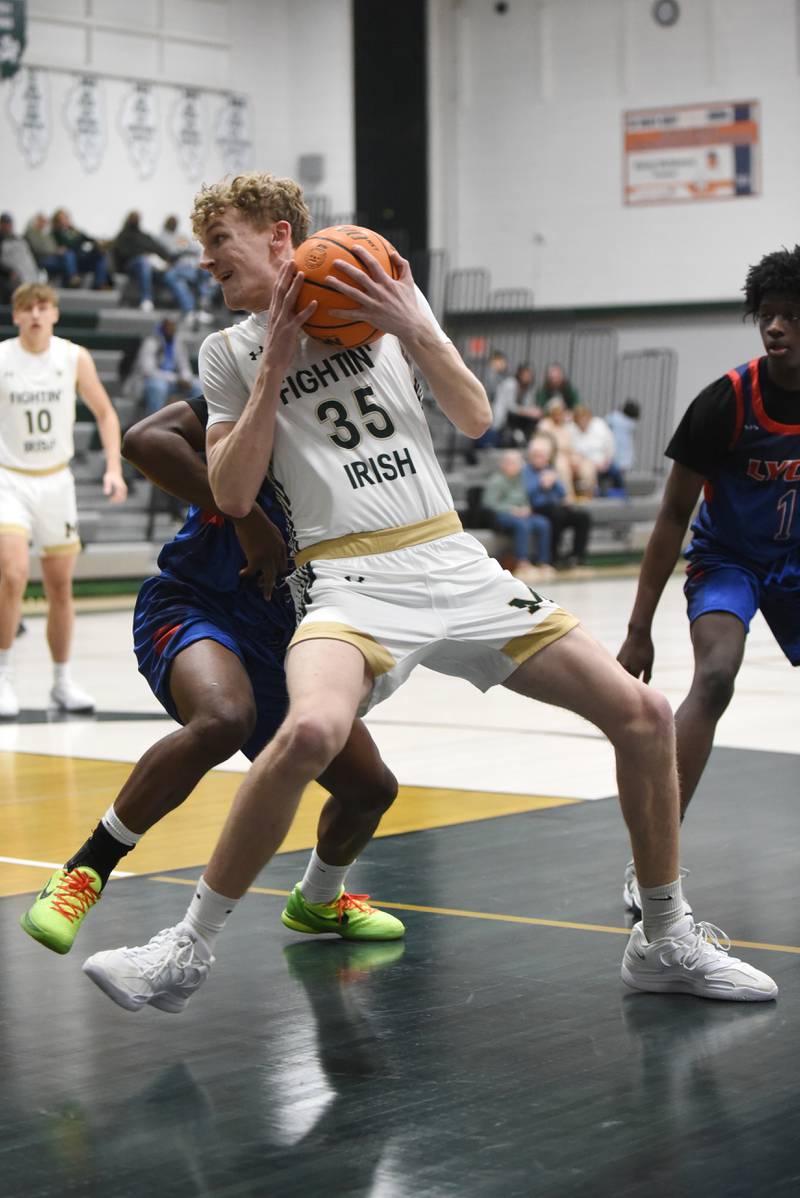 Bishop McNamara's Richard Darr operates in the post during a home game against Lycee Francais de Chicago Wednesday, Feb. 18, 2026.