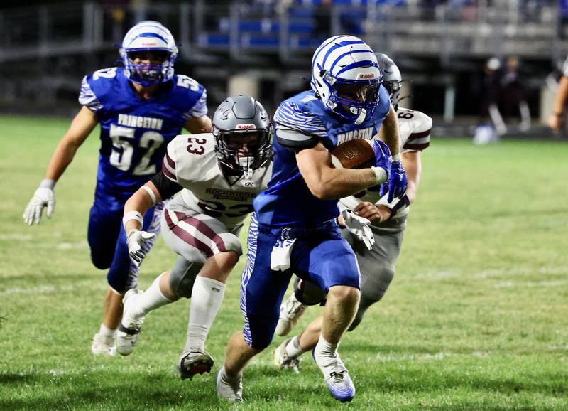 Princeton's Casey Etheridge runs against Rockridge Friday night at Bryant Field. The Rockets won 36-29.