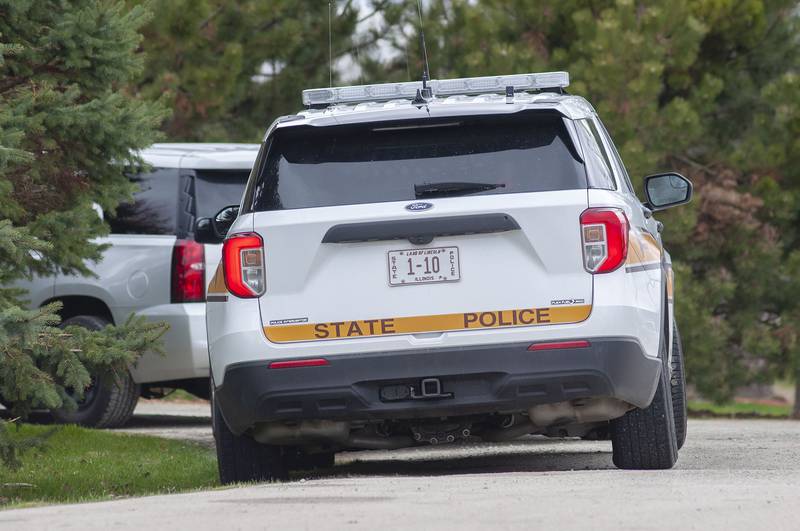The Illinois State Police are seen at a house located at 20775 Hickory Hills Road Monday, April 18, 2022 in Sterling.