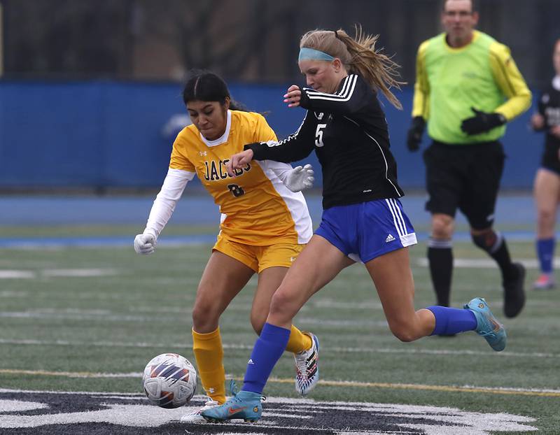 Jacobs' Brianna Gonzalez battles with Lake Zurich’s Ellie Wise for control of the ball during a nonconference girls soccer match Tuesday, April 4, 2023, at Lake Zurich High School.