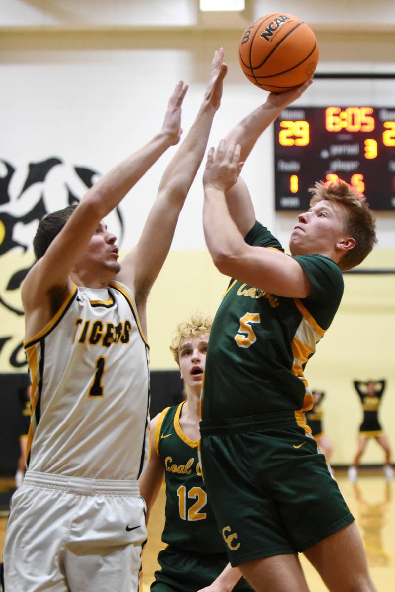 Coal City's Carter Gill, right, takes a shot as Herscher's Tanner Jones defends during a game at Herscher Tuesday, Jan. 27, 2026.