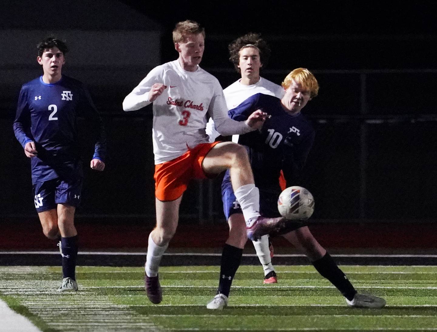 St. Charles East's Marc Walker (3) plays the ball against New Trier's Aidan O'Neill (10) during the class 3A St. Charles North Boys Soccer Supersectional match at St. Charles North High School on Wednesday, Nov. 1, 2023.