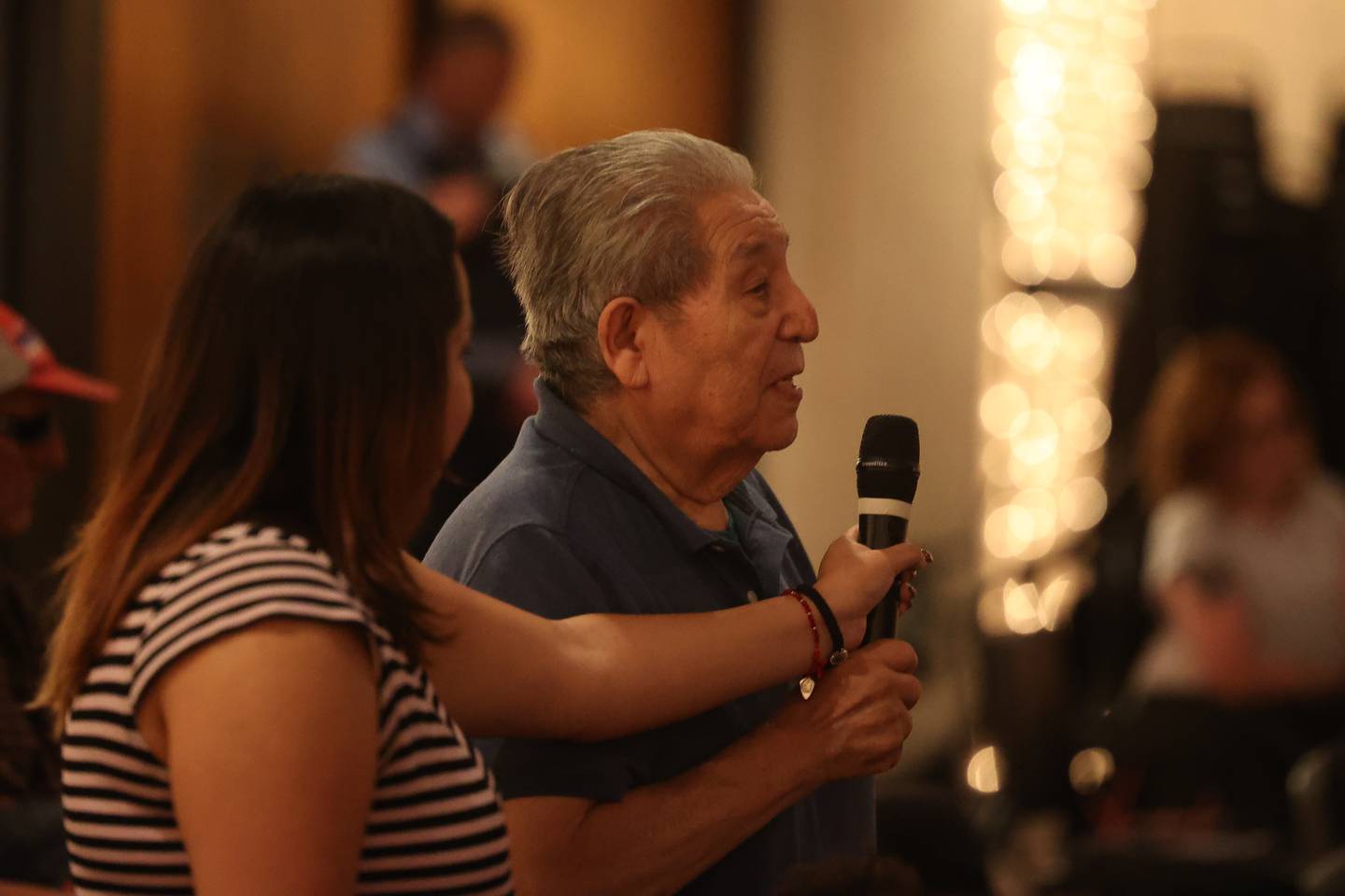Tony Arellano, who is a member of a committee for disability issues, asks a question at a Town Hall meeting hosted by Illinois District 14 Representative Lauren Underwood at Bicentennial Park in Joliet on Wednesday, Aug. 7, 2024.