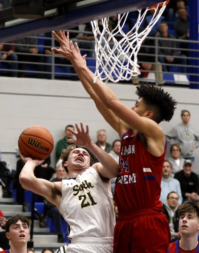 Crystal Lake South's Cooper LePage drives to the basket against Marmion’s Trevon Roots during a IHSA Class 3A Sectional boys basketball game Tuesday, Feb. 28, 2023, at Central High School in Burlington.
