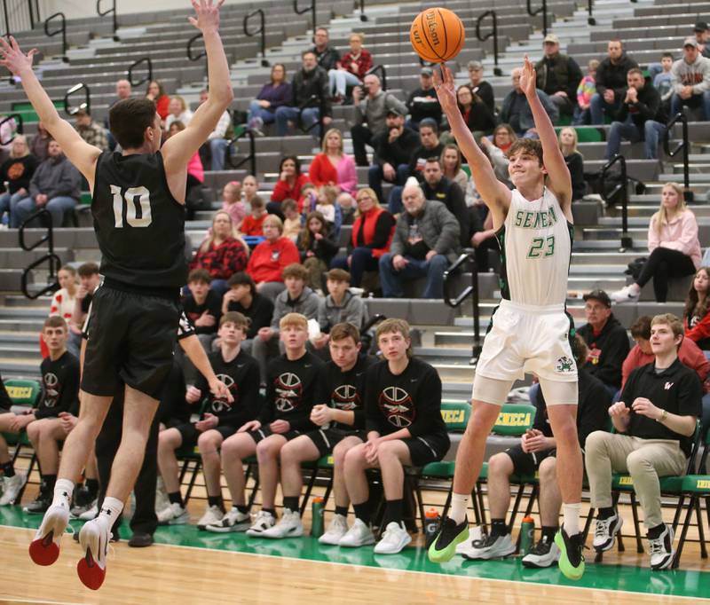Seneca's Brady Sheedy lets go of a shot over Woodland's Jaron Follmer on Friday, Feb. 14, 2025 at Seneca High School.