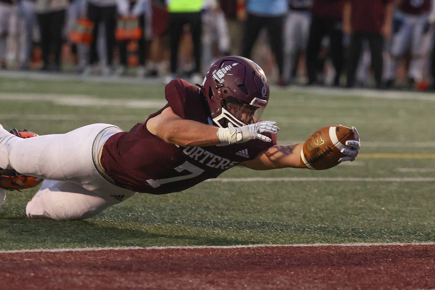 Lockport’s Tyler Pospisil lunges for the the goal line against Naperville North on Friday, Sept. 27, 2024 in Lockport.