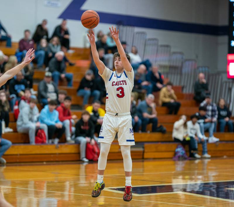 Marmion's Collin Wainscott (3) shoots a three-pointer against Morris during the 59th Annual Plano Christmas Classic basketball tournament at Plano High School on Tuesday, Dec 27, 2022.