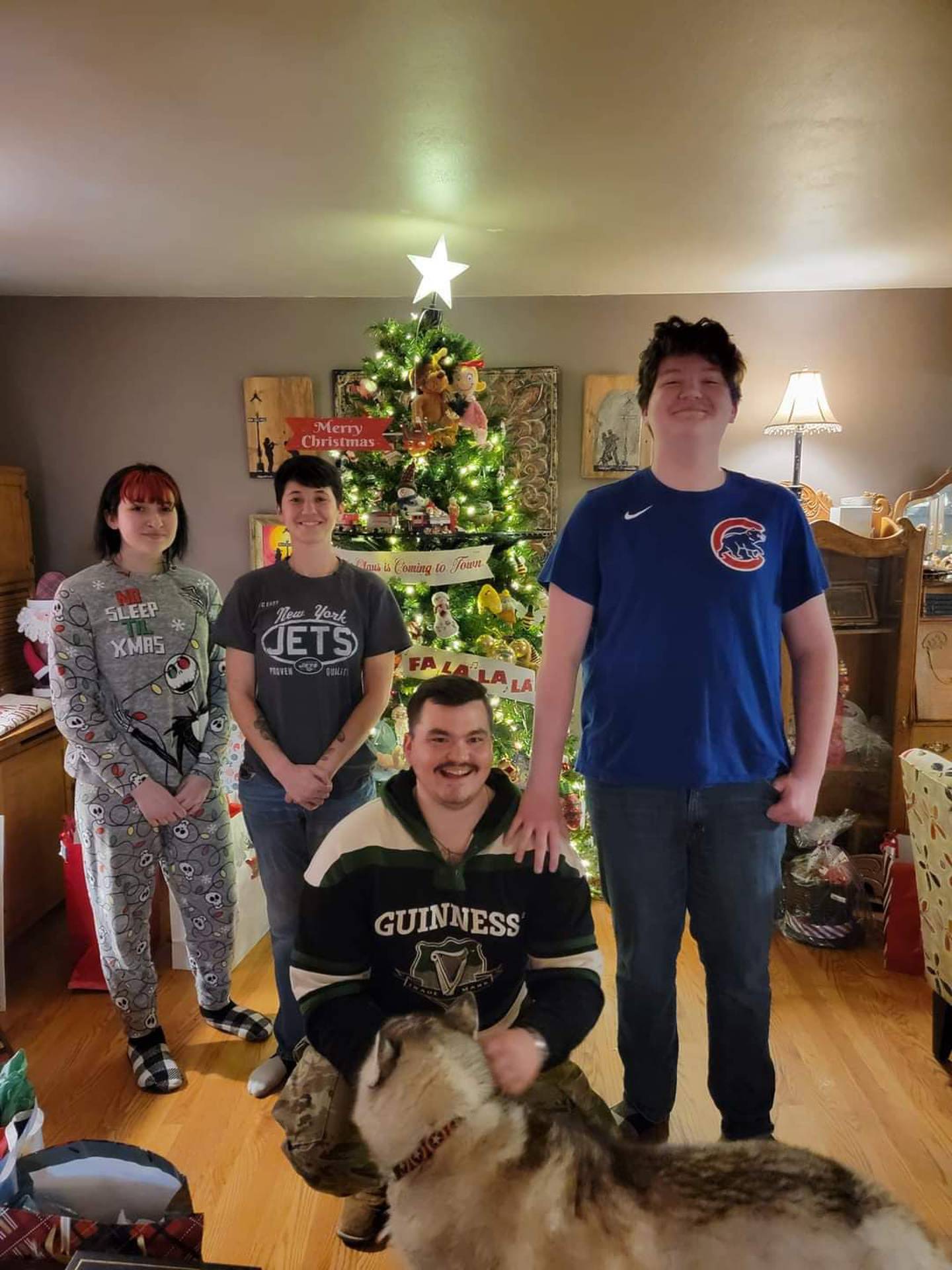 Ryan Chocholek, 25, of Channahon, (front and center) left for Poland on Tuesday, March 8, 2022. He is using his emergency medical technician training to run a medical tent near the Ukraine border. He is pictured with his siblings (from left): Gianna Danno, Megan Chocholek and Giovanni Danno The family dog's name is June.