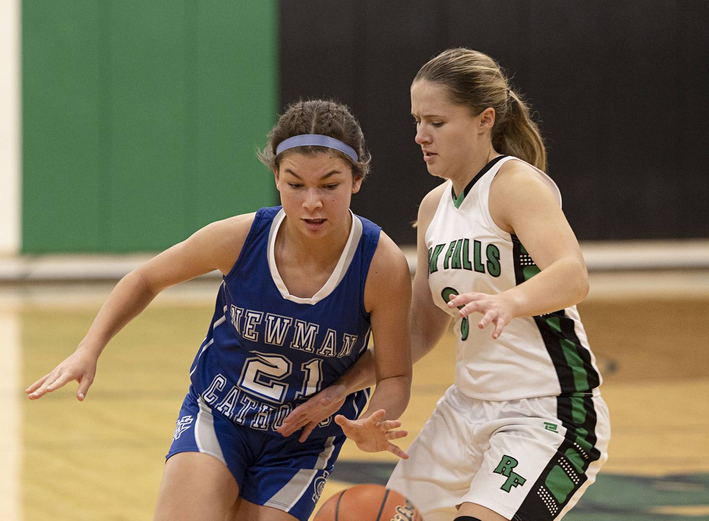 Newman’s Madison Duhon drives against Rock Falls’ Jacee Sigel Thursday, Nov.17, 2022.