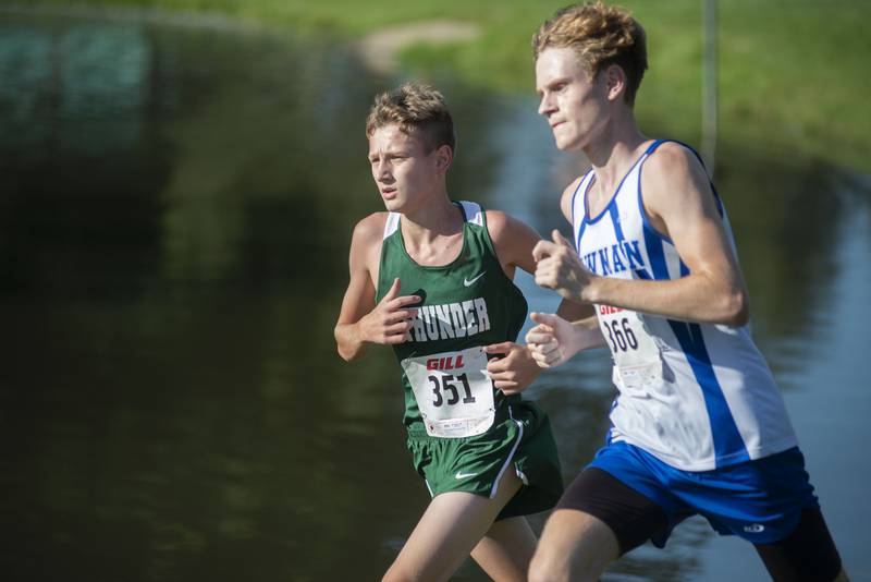 Connor Knop (left) of West Carroll and Newman’s Lucas Simpson race for the finish Tuesday, Aug. 23, 2022 in the Rock Falls Rocket Run at Centennial Park.