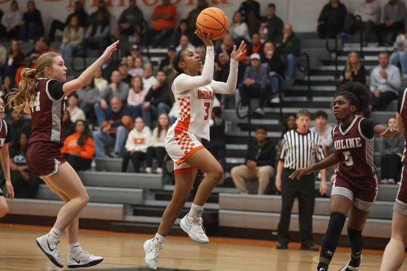 Minooka’s Kendall Thomas floats a shot against Moline in the Class 4A Minooka Regional championship game on Thursday, Feb. 19, 2026 in Minooka.