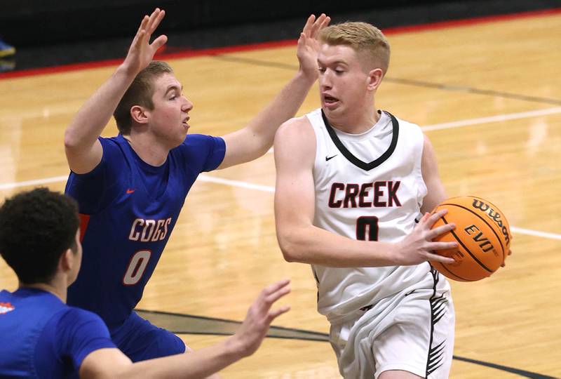 Indian Creek's Everett Willis drives against Genoa-Kingston's Nathan Kleba during their game Friday, Jan. 3, 2025, at Indian Creek High School in Shabbona.