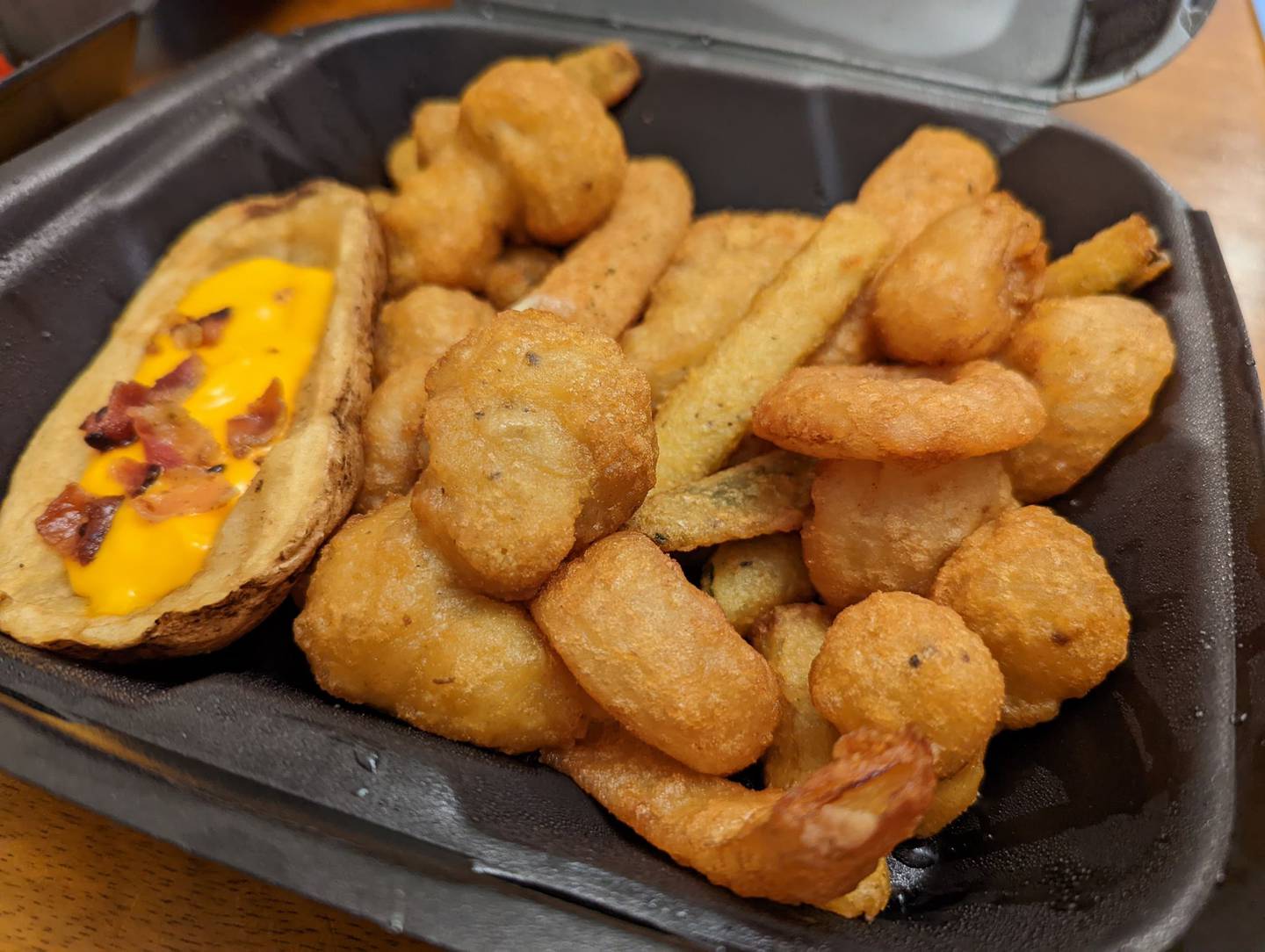 The appetizer combo platter for $10 at Happy Place Cafe in Shorewood includes cheese sticks, onion rings, potato skins, breaded mushrooms, zucchini and cauliflower.
