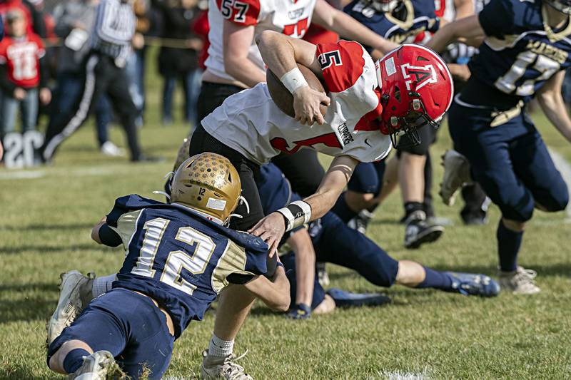 Amboy’s Landon Whelchel fights for yards against Polo Saturday, Nov. 11, 2023 during a semifinal 8-man football game in Polo.