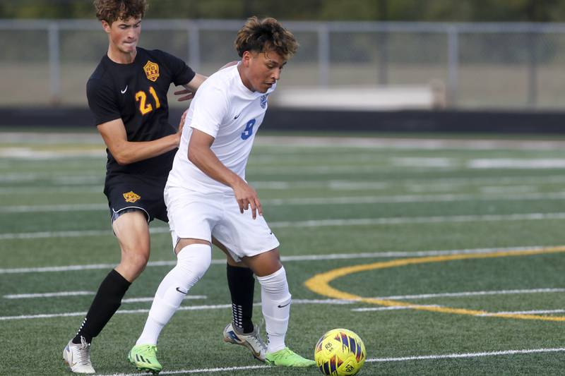Woodstock’s Eric Jacinto controls the ball in front of Richmond-Burton’s Trey Maziarz during a Kishwaukee River Conference soccer match on Wednesday, Sept. 10, 2025, at Richmond-Burton High School, in Richmond.