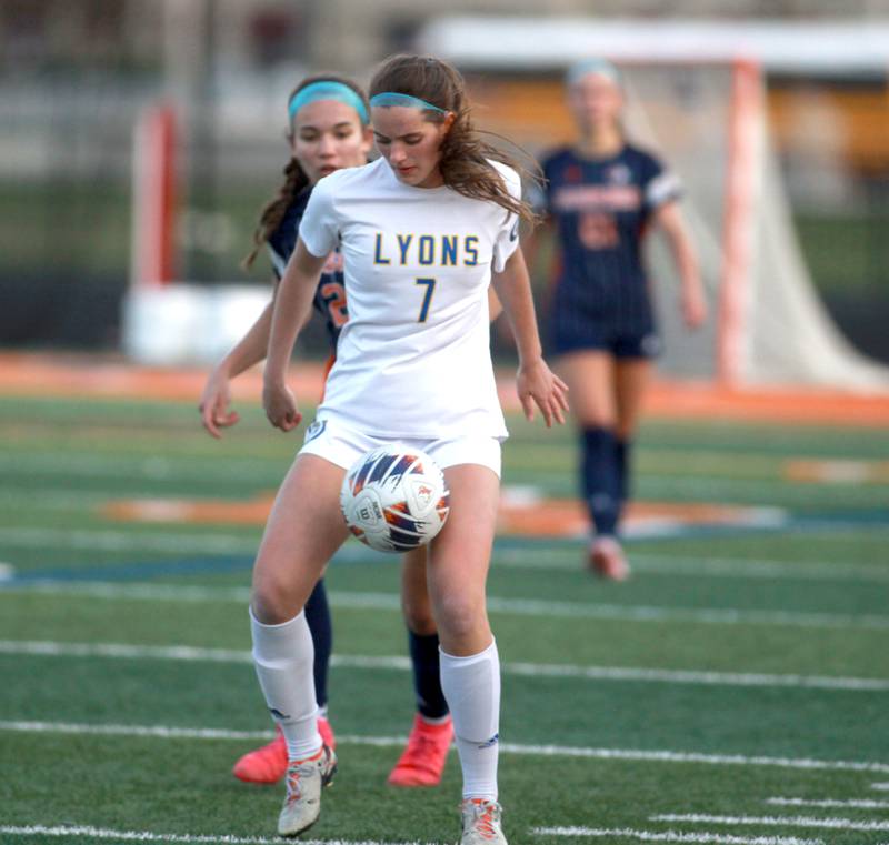 Lyons Township's Caroline Mortonson gets control of the ball during a game against Naperville North on Wednesday, April 16, 2025 in Naperville.