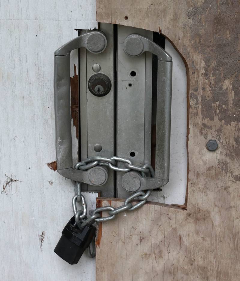 The front door is padlocked at the long-vacant former St. Mary’s Hospital at 145 Fisk Ave. on Wednesday, July 30, 2025, in DeKalb.