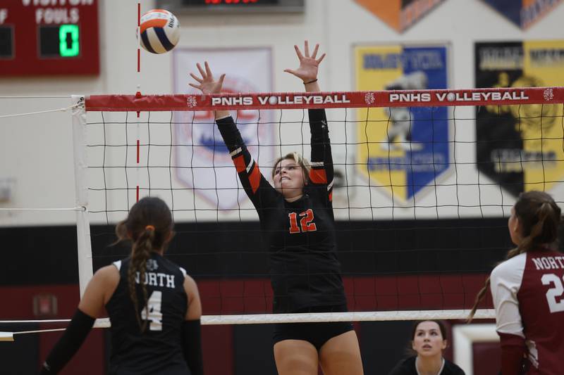 Plainfield East’s Faith Fitzgerald goes for the block against Plainfield North on Tuesday, Oct. 10, 2023 in Plainfield.