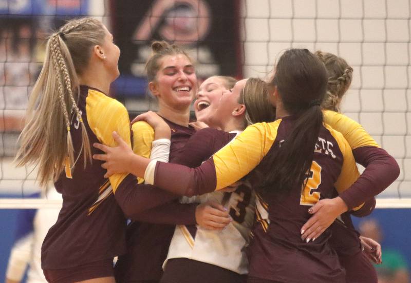 Richmond-Burton’s Rockets celebrate a win in varsity girls volleyball at Johnsburg High School in Johnsburg on Thursday, August 25, 2025.