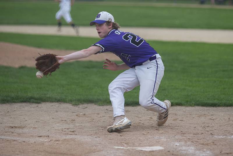 Dixon’s Kyle Adkins can’t take the throw from the catcher after a wild pitch Tuesday, May 17, 2022.
