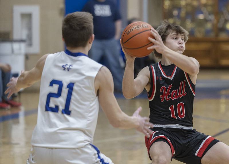 Hall’s Greyson Bickett looks to pass against Newman Friday, Feb. 2, 2024 at Newman High School.