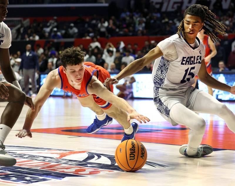 Eastland's Peyton Spears (left) and Chicago Hope Academy's Noah Jones go after a loose ball during their IHSA Class 1A state championship game Saturday, March 15, 2025, in the State Farm Center at the University of Illinois in Champaign.