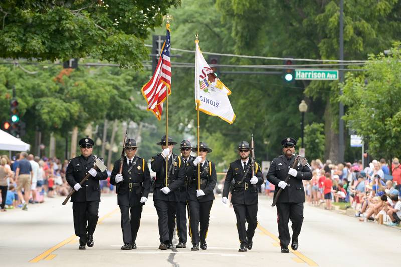The Wheaton Police and Fire Honor Guard head up the Wheaton 2024 Independence Day Parade on Thursday, July 4, 2024.