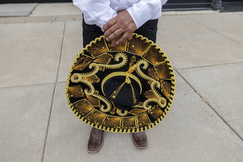 Roberto Flores stands alongside the Fiesta Parade in Sterling Saturday, Sept. 20, 2025.