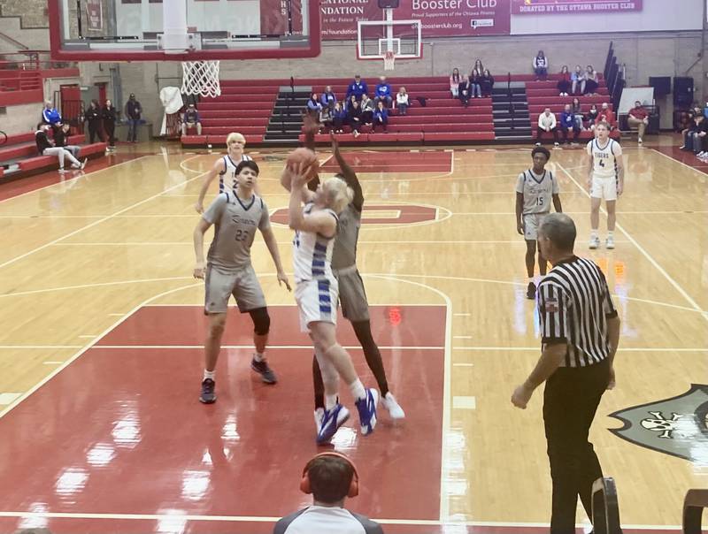 Princeton's Daniel Sousa shoots in the paint during Saturday's fifth-place game of the Ottawa Thanksgiving Tournament against Plano. The Tigers won 59-56 in overtime.