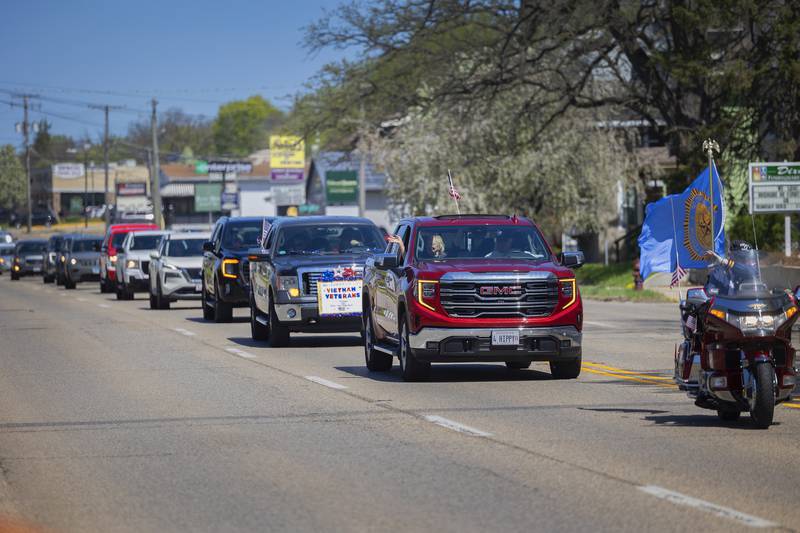 A parade of vehicles carrying Vietnam veterans make their way through Dixon Saturday, April, 26, 2025. The parade ended at the Dixon VFW with a luncheon celebrating the vets.