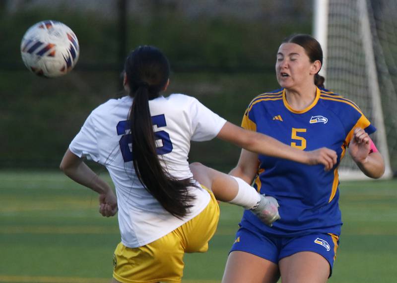 Cristo Rey St. Martin's Zaory Munoz tries to stop Johnsburg's Elaina Moss from playing the ball during an IHSA Class 1A Cristo Rey St. Martin Sectional semifinal girls soccer match on Tuesday, May 26, 2026 at Cristo Rey St. Martin College Prep, in Waukegan.